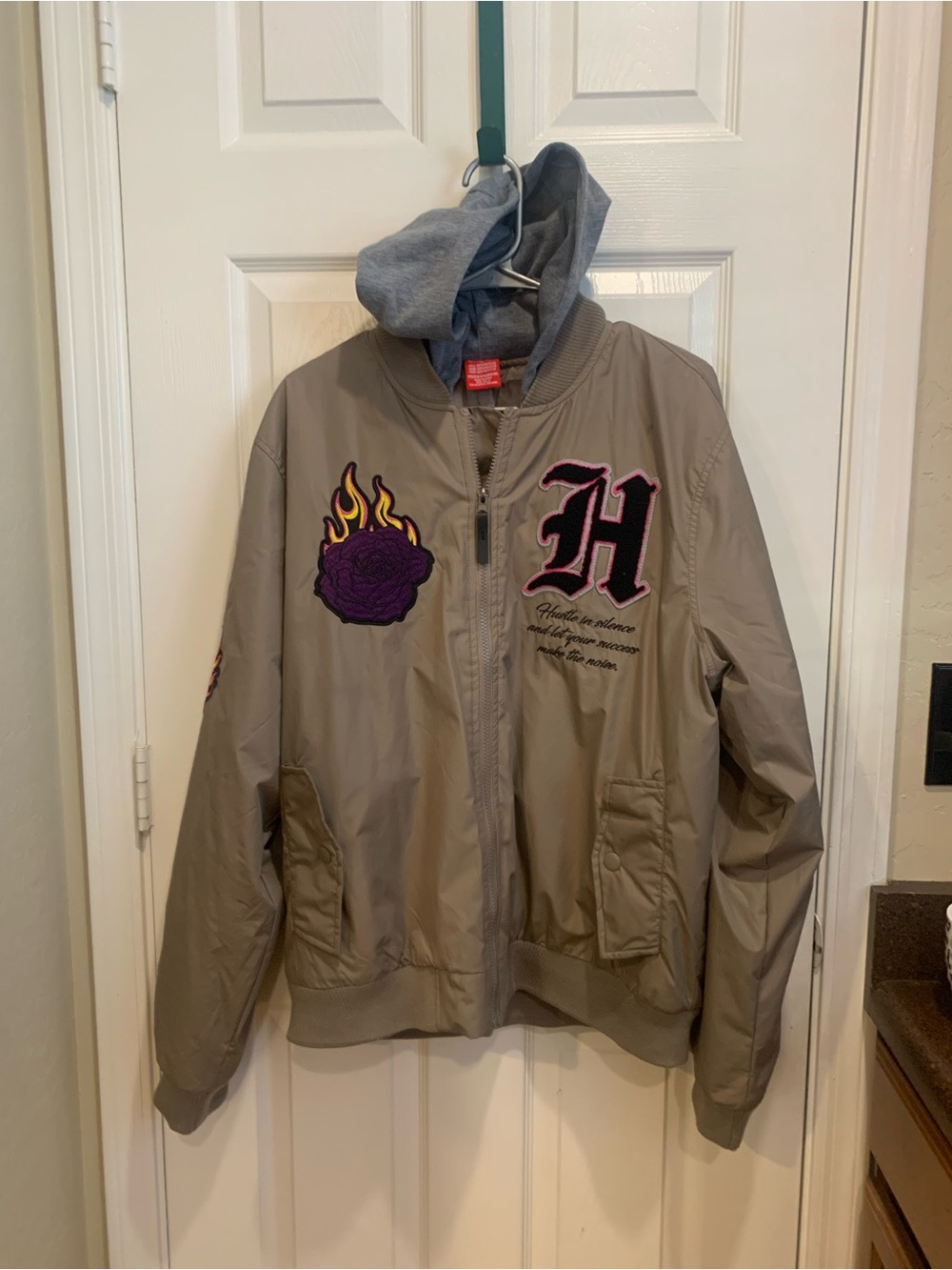 Ring of Fire Tan Jacket with Gray Hood and Pink Patch